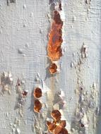 rusty stains on a white wall