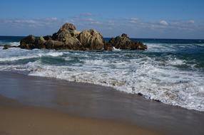 foamy waves on beach