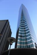 glass skyscraper at blue sky background in Paris