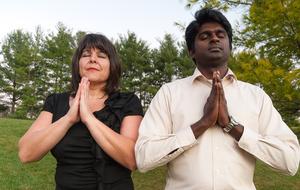 Couple Praying in forest