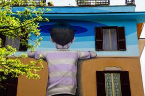 drawing of a boy on a house