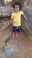 child Boy with Curly Hair posing outdoor