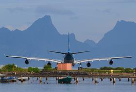Airplane taking off against the lake