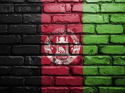 stone wall with a graffiti flag