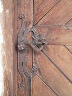 patterned rusty handle on the door
