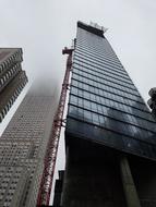 skyscrapers of Manhattan in fog, US