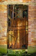 old front door on a brick facade