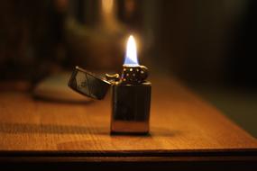 lighted lighter on the table