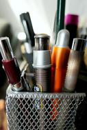 pens and pencils in a basket