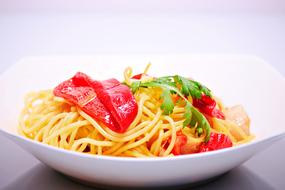 noodles and vegetables on a white background