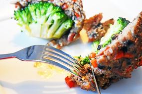 fish dish with vegetables on a plate