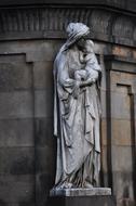 Figure woman with baby