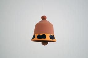 bell made of brown clay