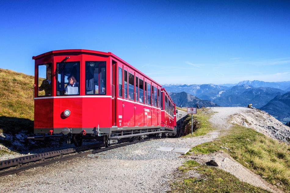 red train passing through the mountains