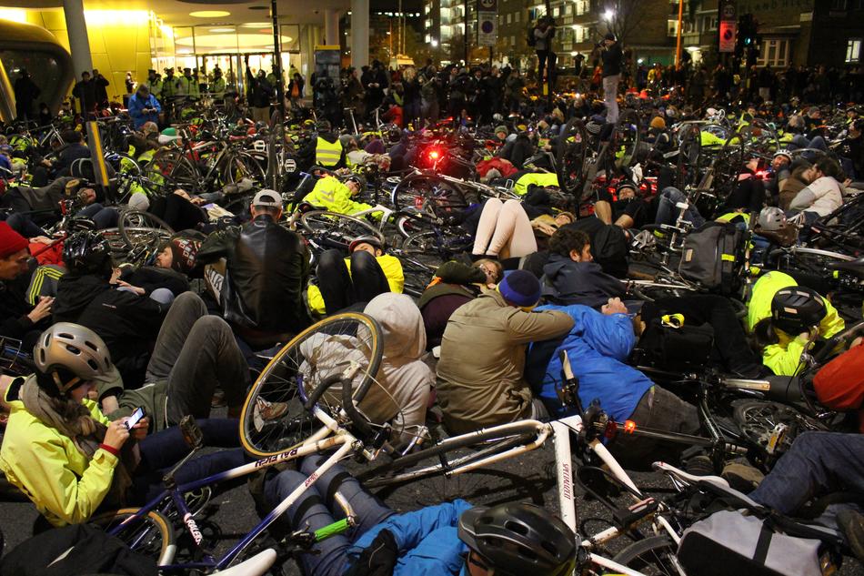 people sitting by the bikes