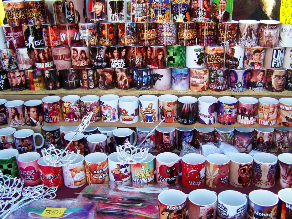 colored mugs on sale at the fair