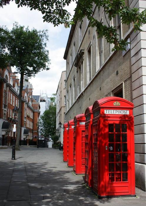 red booths on the background of the city