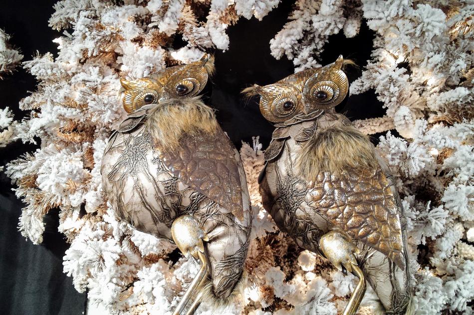 figures of owls in white flowers