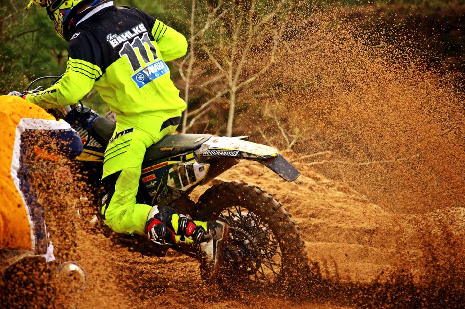 motorcyclist rides on dirt