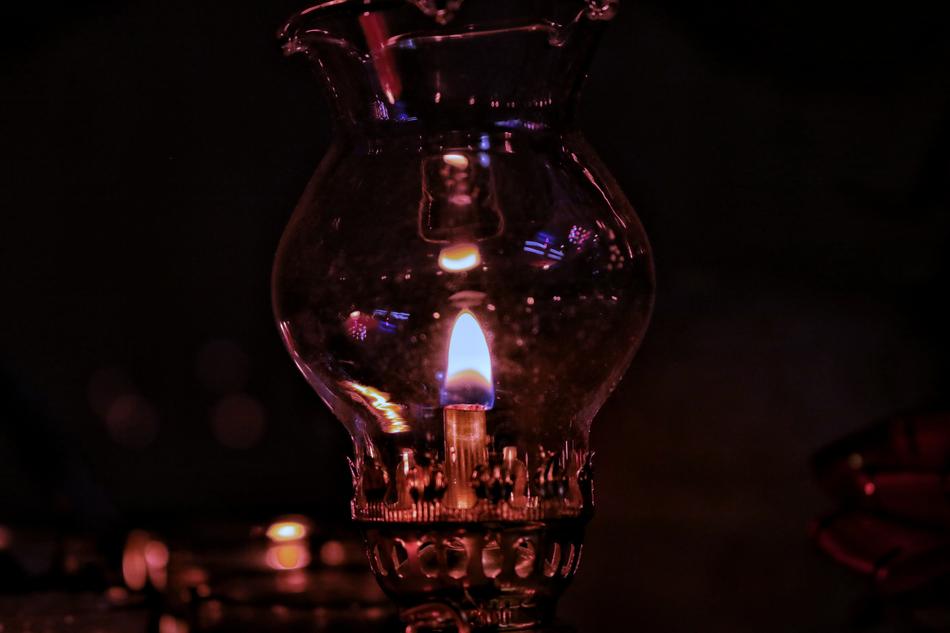 photo of an oil lamp in the dark