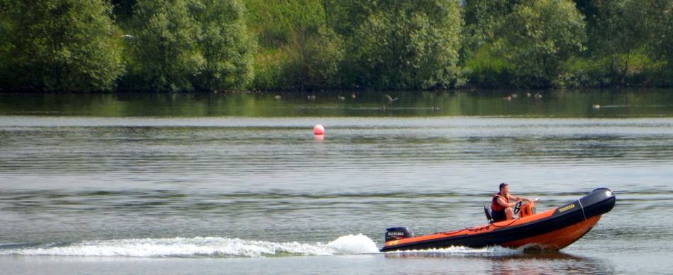 a man on a boat in the lake