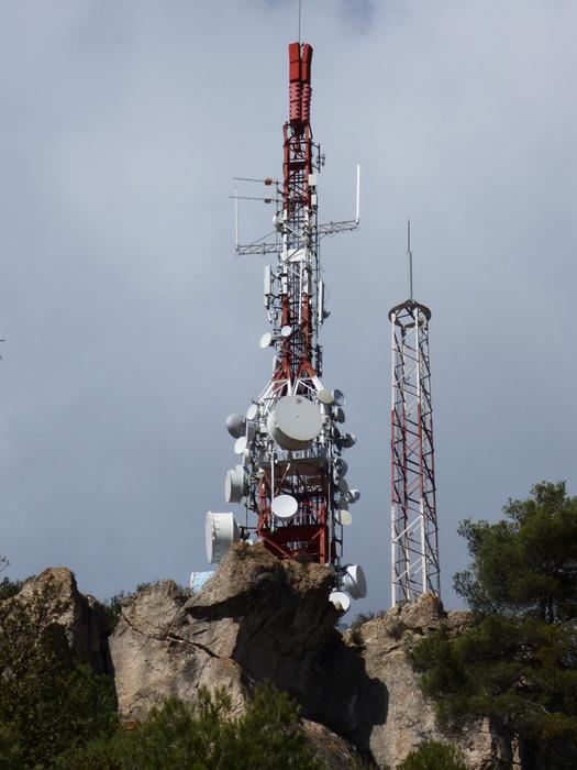 high tower with radio waves