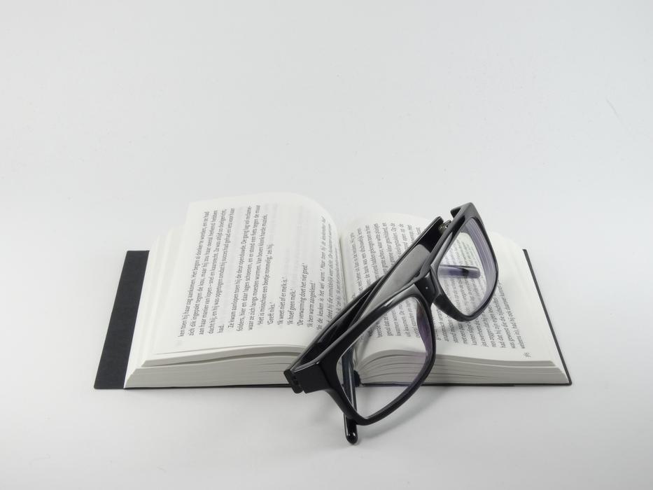 eyeglasses on a book