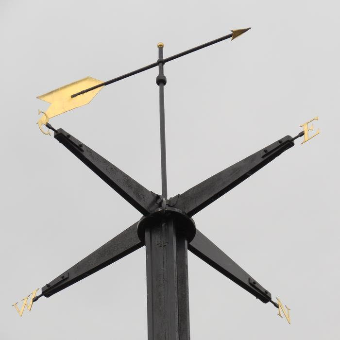 compass statue against the sky