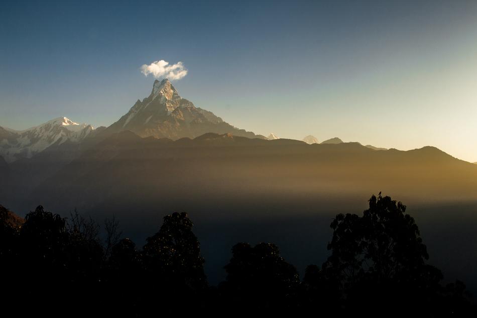 large mountain with the sunset as a backdrop