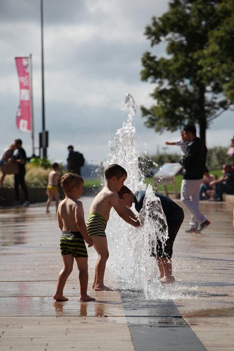 children playing in the fountain