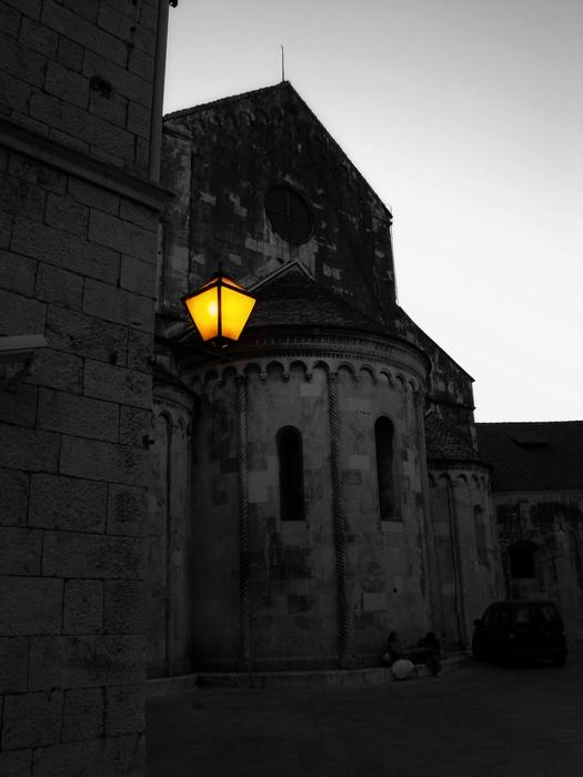 a street lamp outside an old house