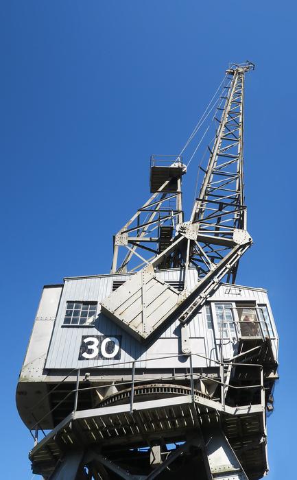 Old crane with number '30', under the blue sky