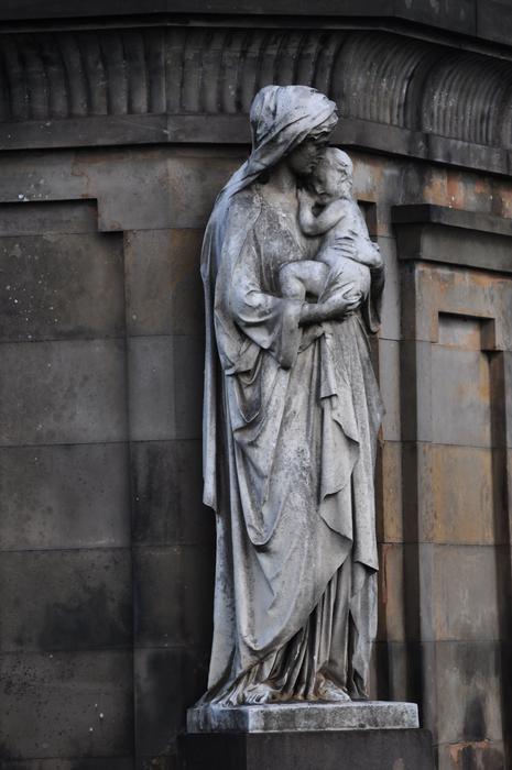Figure woman with baby
