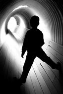 Black And White, Child Boy plays in tunnel