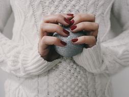 girl holding a сhristmas ball