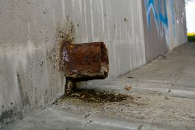 rusty pipe in the wall