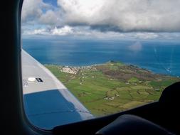 Light Aircraft Flying Coastline