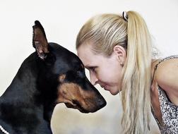 a girl and a Doberman portrait