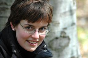 photo of a short-haired girl in glasses