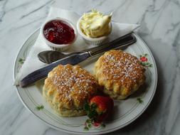 Scones with strawberries and jam