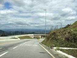 road against the cloudy sky