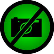 Black and green icon with the prohibition of taking photos, clipart