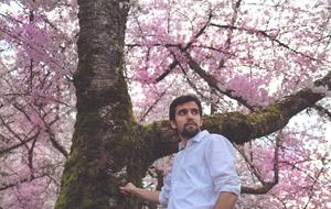 Young Man Model near pink flowered tree