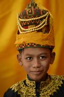 asian Child boy in traditional Yellow headdress