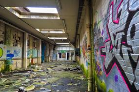 Beautiful, old, abandoned building with the colorful graffities