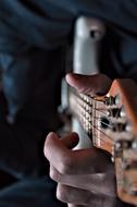 Guitar playing man