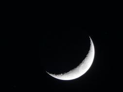 half of the moon in the black sky