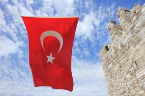 the turkish flag is on castle