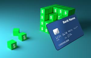 credit card in the background of a green cube