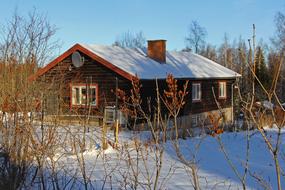 traditional swedish wooden house at Snowy Winter